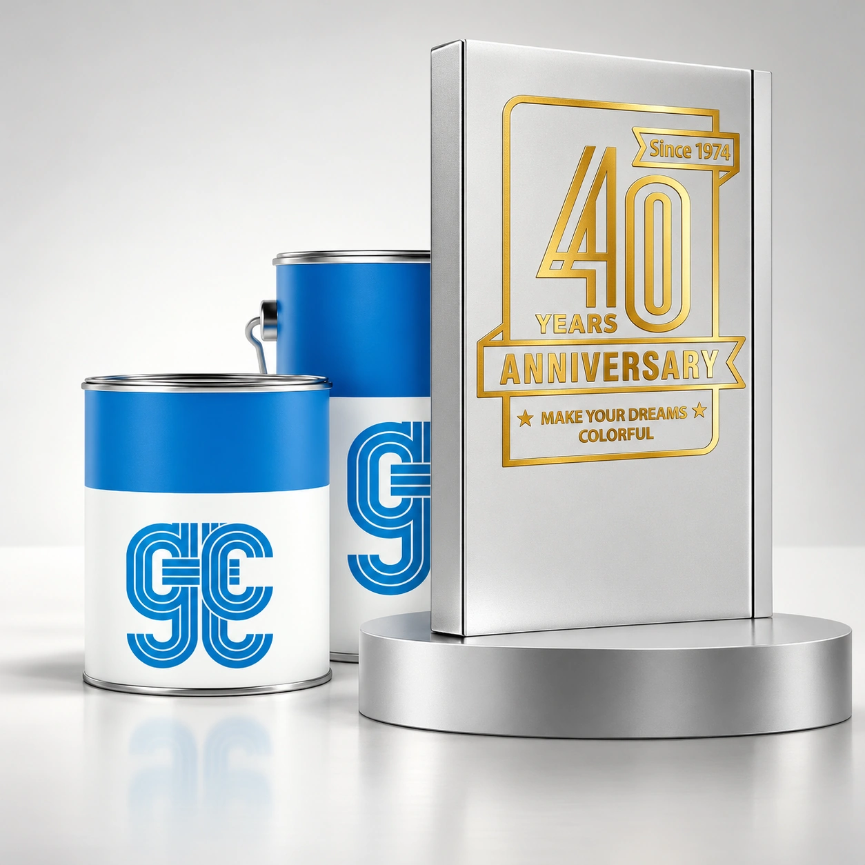 Restored anniversary campaign showing two blue-and-white GTC paint tins beside a silver plaque with glowing gold 40-year anniversary lettering